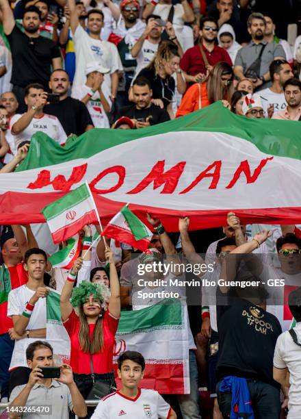 Fans of Iran support their team with the slogan woman on the flags during the FIFA World Cup Qatar 2022 Group B match between England and IR Iran at...