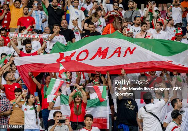 Fans of Iran support their team with the slogan woman on the flags during the FIFA World Cup Qatar 2022 Group B match between England and IR Iran at...