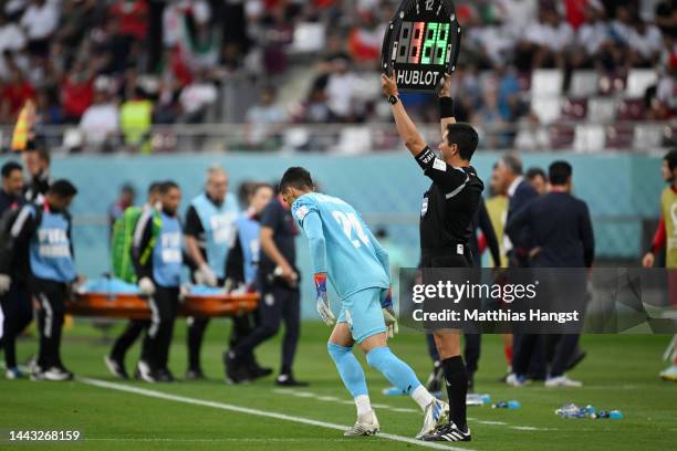 Hossein Hosseini of IR Iran is brought in for Alireza Beiranvand during the FIFA World Cup Qatar 2022 Group B match between England and IR Iran at...