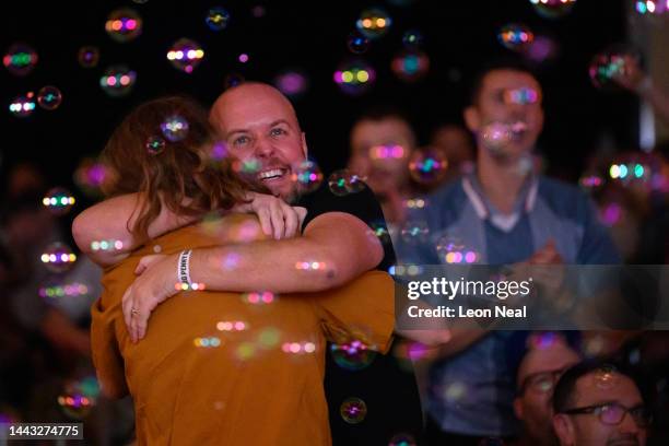 Fans react after the first goal from England as they watch England's opening group-round match versus Iran in the Big Penny Social in Walthamstow on...