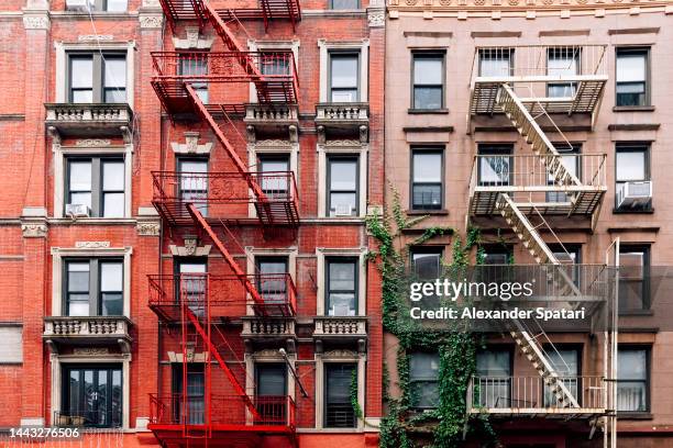 apartment buildings with fire escape ladders in new york city, usa - the soho house stock pictures, royalty-free photos & images