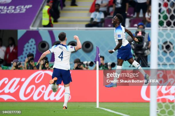 Bukayo Saka of England celebrates with Declan Rice after scoring their team's second goal during the FIFA World Cup Qatar 2022 Group B match between...
