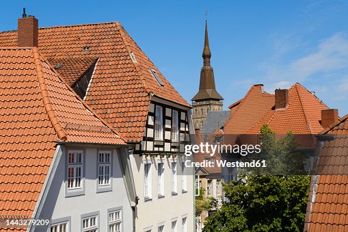 Germany, Lower Saxony, Osnabruck, Old town houses with bell tower of Saint Marys Church in background Germany, Lower Saxony, Osnabruck, Old town houses with bell tower of Saint Marys Church in background