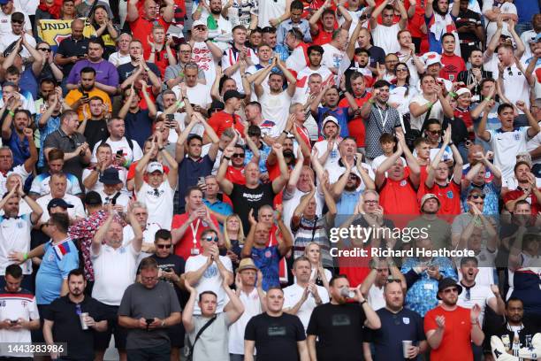 England fans cheer in the stands during the FIFA World Cup Qatar 2022 Group B match between England and IR Iran at Khalifa International Stadium on...