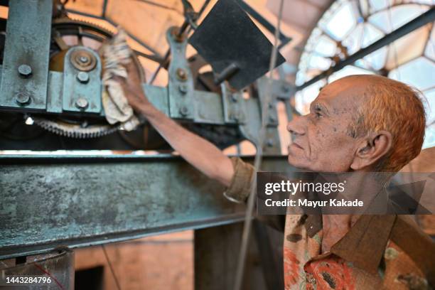 Man Fixing Clock Old Man Fixing Clock Photos and Premium High Res Pictures - Getty Images