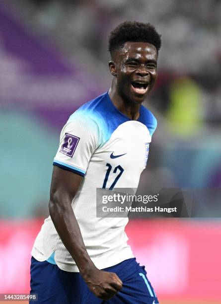 Bukayo Saka of England celebrates after scoring their team's fourth goal during the FIFA World Cup Qatar 2022 Group B match between England and IR...