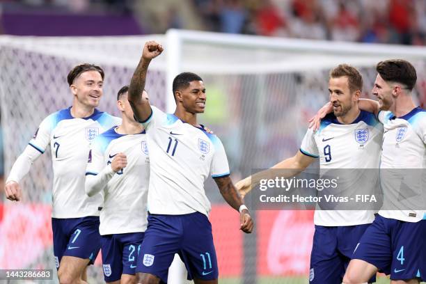 Marcus Rashford of England celebrates with teammates after scoring their team's fifth goal during the FIFA World Cup Qatar 2022 Group B match between...