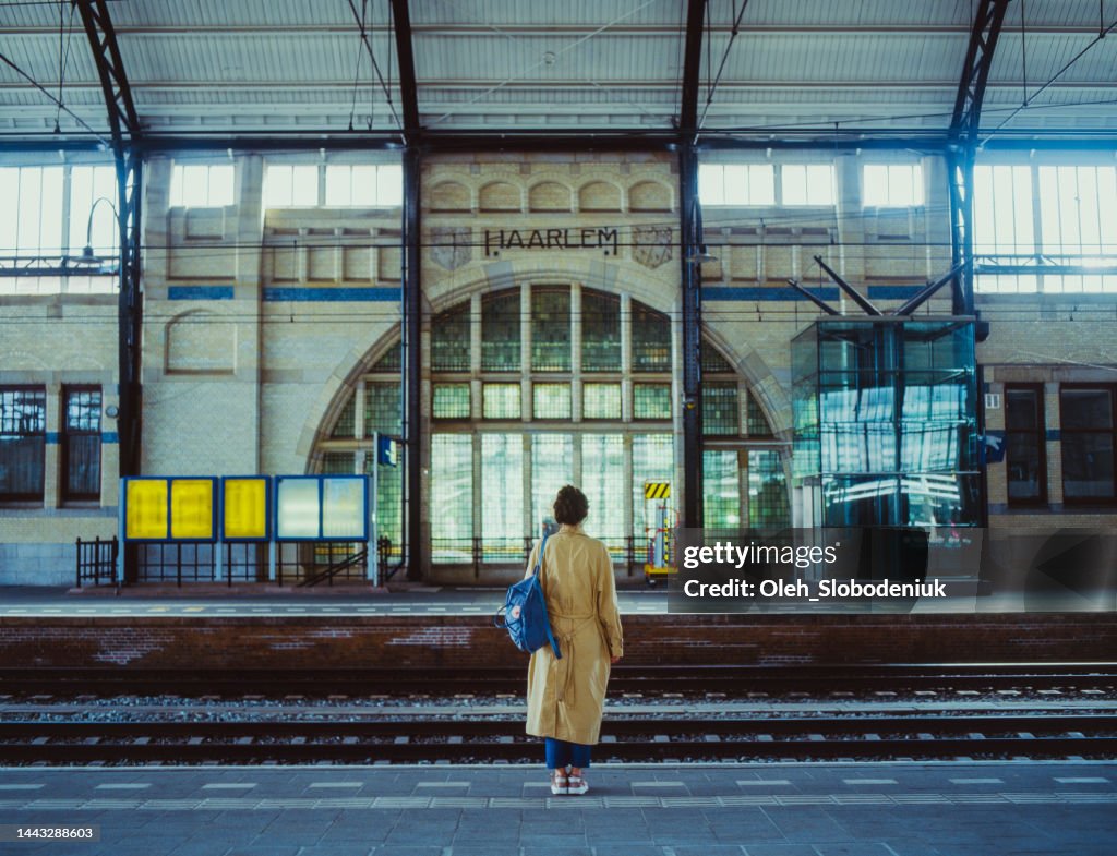 Woman waiting for the train on railway station