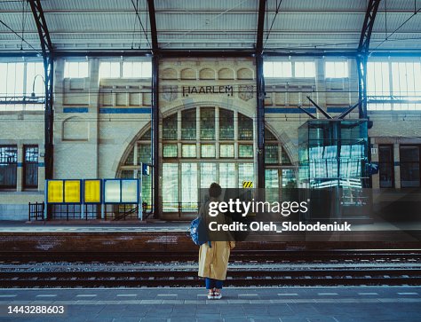 Woman waiting for the train on railway station