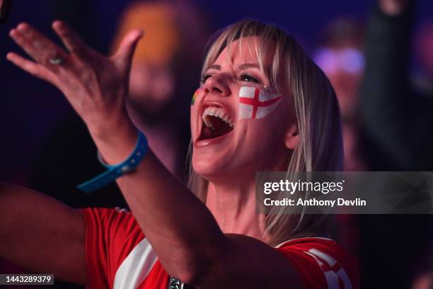 Supporter wearing face paint reacts as she watches England's first FIFA World Cup Qatar 2022 match against the Islamic Republic of Iran on the big...