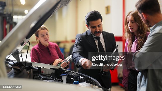 Car Insurance Experts Car Insurance Expert Checking Broken Car And Discussing With Couple ...