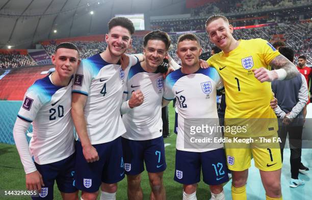 Phil Foden, Declan Rice, Jack Grealish, Kieran Trippier and Jordan Pickford of England celebrate following the FIFA World Cup Qatar 2022 Group B...