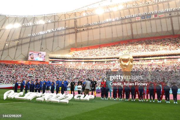 Players and match officials line up prior to the FIFA World Cup Qatar 2022 Group B match between England and IR Iran at Khalifa International Stadium...