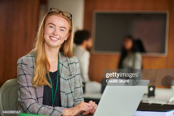 settling into her new job - girl in office stock pictures, royalty-free photos & images