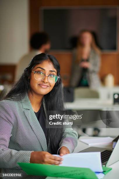 proud young business graduate - file clerk stock pictures, royalty-free photos & images