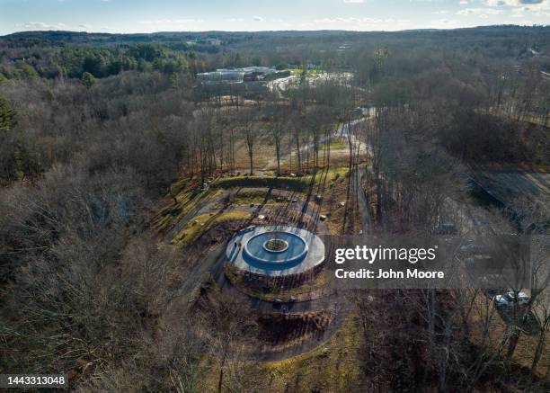 As seen from an aerial view, people visit the newly-opened Sandy Hook Permanent Memorial on November 20, 2022 in Newtown, Connecticut near Sandy Hook...