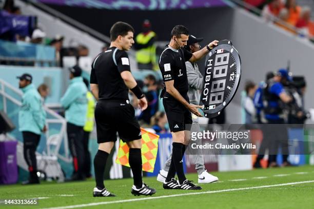 The fourth official Andres Matonte shows the amount of added time for the first half during the FIFA World Cup Qatar 2022 Group A match between...