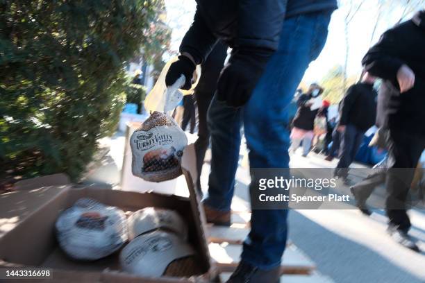 Free Thanksgiving turkeys are distributed at the Holy Innocents Roman Catholic Church in Brooklyn on November 21, 2022 in New York City. Over 1000...