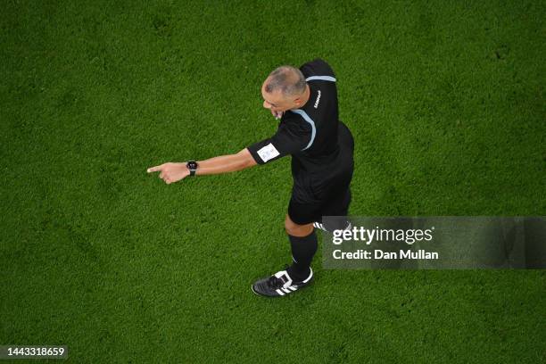 Referee Wilton Sampaio gestures during the FIFA World Cup Qatar 2022 Group A match between Senegal and Netherlands at Al Thumama Stadium on November...