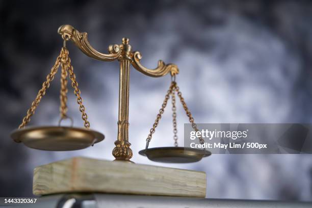 close up of libra scale against gray background,malaysia - legal penalty stock pictures, royalty-free photos & images