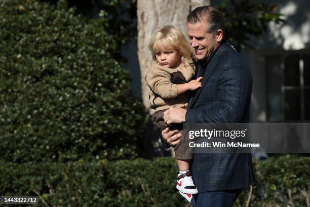 Hunter Biden, the son U.S. President Joe Biden, holds his son Beau as they arrive for the National Thanksgiving Turkey pardoning ceremony on the...