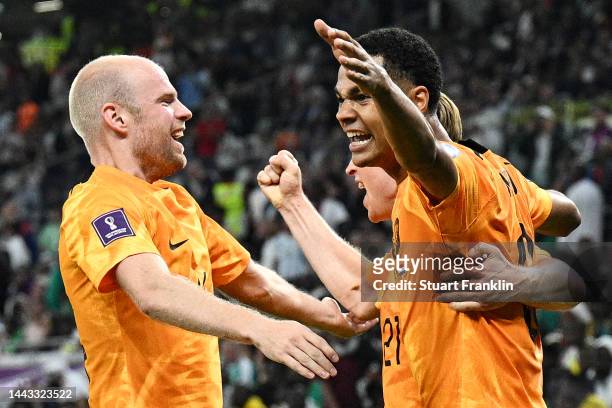 Cody Gakpo celebrates with Frenkie de Jong of Netherlands after scoring their team's first goal during the FIFA World Cup Qatar 2022 Group A match...