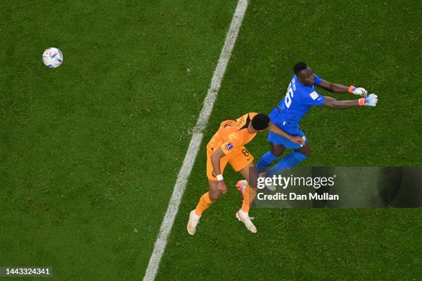 Cody Gakpo of Netherlands scores their team's first goal past Edouard Mendy of Senegal during the FIFA World Cup Qatar 2022 Group A match between...