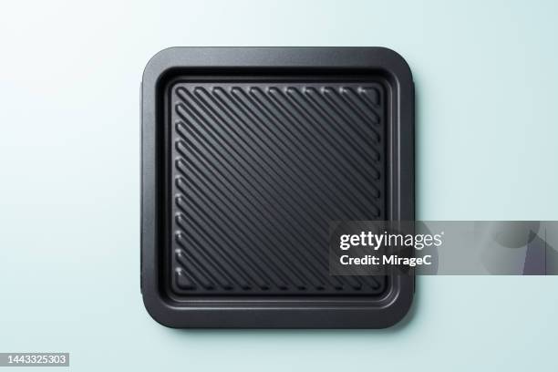 non-stick grooved baking sheet - baking sheet stock pictures, royalty-free photos & images