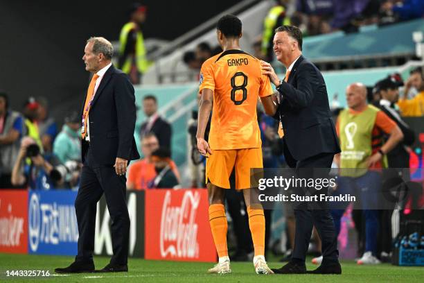 Cody Gakpo of Netherlands celebrates with Louis van Gaal, Head Coach of Netherlands, after scoring their team's first goal during the FIFA World Cup...