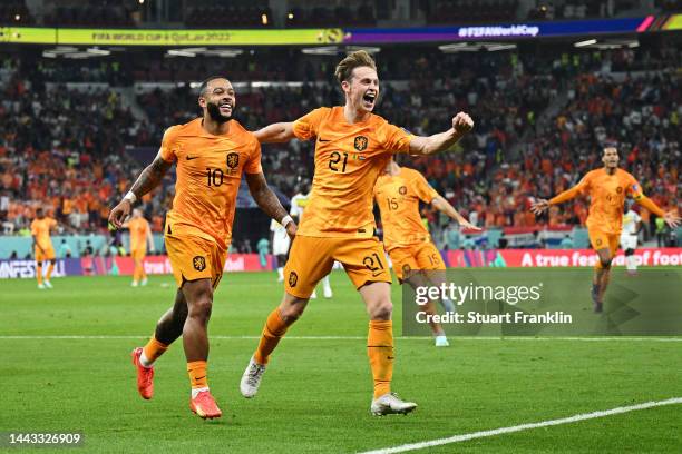 Memphis Depay and Frenkie de Jong of Netherlands celebrate their team's second goal by Davy Klaassen during the FIFA World Cup Qatar 2022 Group A...