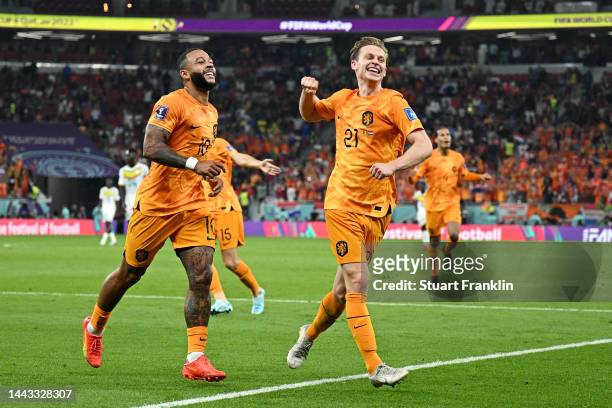Memphis Depay and Frenkie de Jong of Netherlands celebrate their team's second goal by Davy Klaassen during the FIFA World Cup Qatar 2022 Group A...