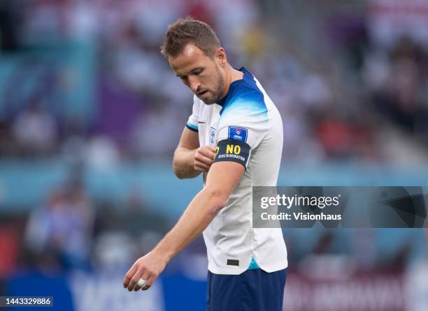 Harry Kane of England adjusts his captain's armband during the FIFA World Cup Qatar 2022 Group B match between England and IR Iran at Khalifa...