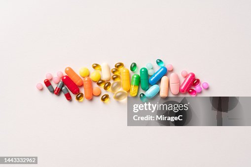 Multi Colored Medical Pills Organized in a Row Multi Colored Medical Pills Organized in a Row