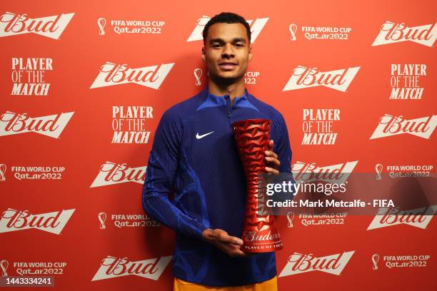 Cody Gakpo of Netherlands poses with the Budweiser Player of the Match Trophy following the FIFA World Cup Qatar 2022 Group A match between Senegal...