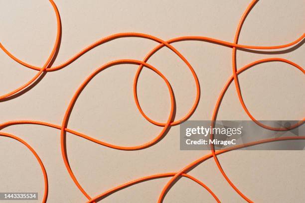 orange colored ropes scribble pattern - orange string stock pictures, royalty-free photos & images