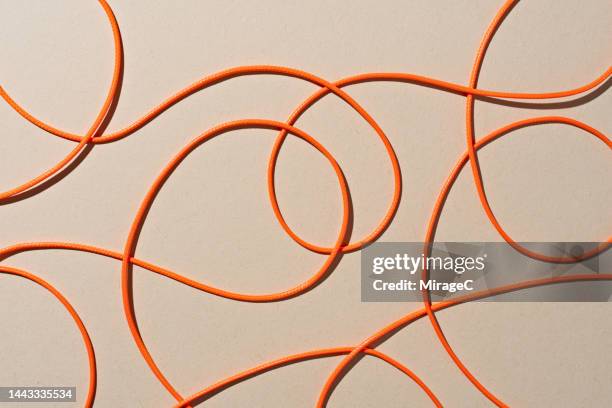 orange colored ropes scribble pattern - filament stock pictures, royalty-free photos & images