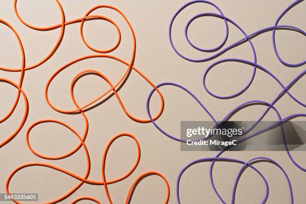 colored ropes tangled and connected scribble - tangle stock pictures, royalty-free photos & images