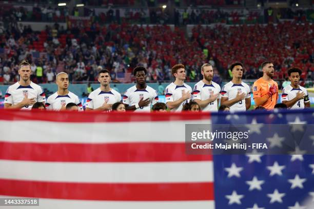 United States players sings their national anthem prior to the FIFA World Cup Qatar 2022 Group B match between USA and Wales at Ahmad Bin Ali Stadium...