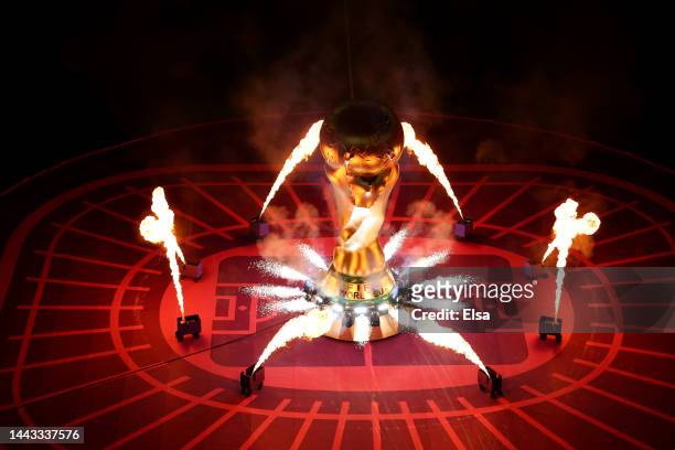 Pyrotechnics surround a giant FIFA World Cup trophy on the pitch prior to the FIFA World Cup Qatar 2022 Group B match between USA and Wales at Ahmad...