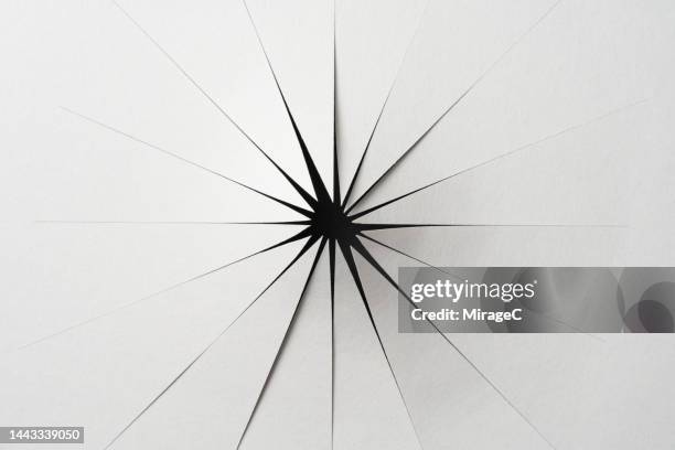 paper hole cut out in radial shape - trou photos et images de collection