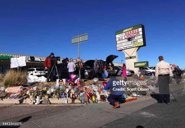 People visit a makeshift memorial near the Club Q nightclub on November 21, 2022 in Colorado Springs, Colorado. On Saturday evening, a 22-year-old...