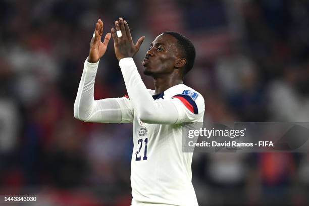 Timothy Weah of United States celebrates after scoring their team's first goal during the FIFA World Cup Qatar 2022 Group B match between USA and...