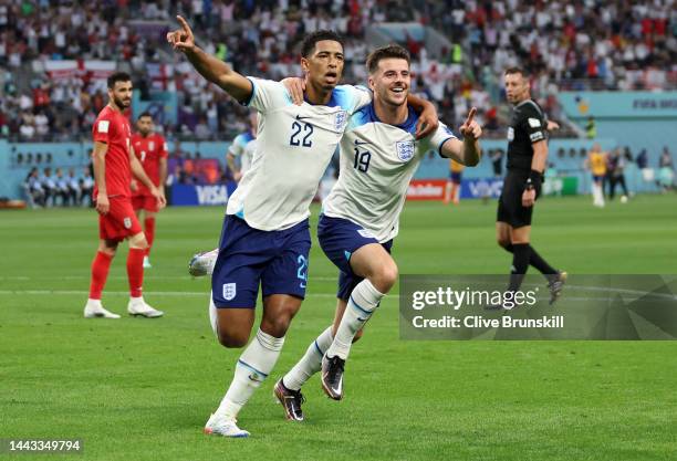 Jude Bellingham of England celebrates with Mason Mount after scoring their team's first goal during the FIFA World Cup Qatar 2022 Group B match...