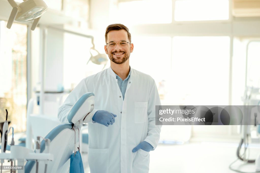 Smiling young dentist
