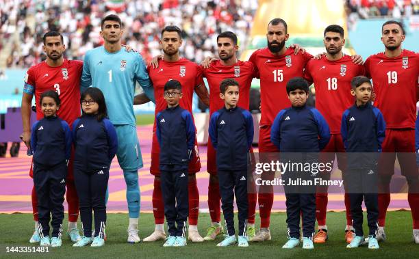 Iran players line up for the national anthem prior to the FIFA World Cup Qatar 2022 Group B match between England and IR Iran at Khalifa...