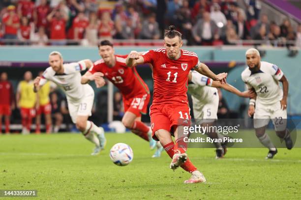 Gareth Bale of Wales scores their team's first goal via a penalty during the FIFA World Cup Qatar 2022 Group B match between USA and Wales at Ahmad...