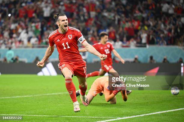 Gareth Bale of Wales celebrates after scoring their team's first goal via a penalty during the FIFA World Cup Qatar 2022 Group B match between USA...
