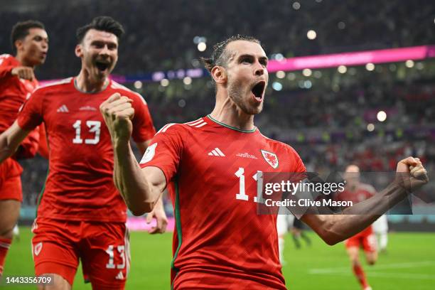 Gareth Bale of Wales celebrates after scoring their team's first goal via a penalty past Matt Turner of United States during the FIFA World Cup Qatar...