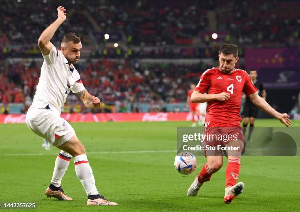 Jordan Morris of United States crosses while Ben Davies of Wales attempts to block during the FIFA World Cup Qatar 2022 Group B match between USA and...