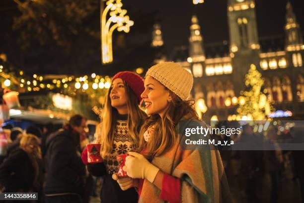 enjoying on christmas market - austria stock pictures, royalty-free photos & images